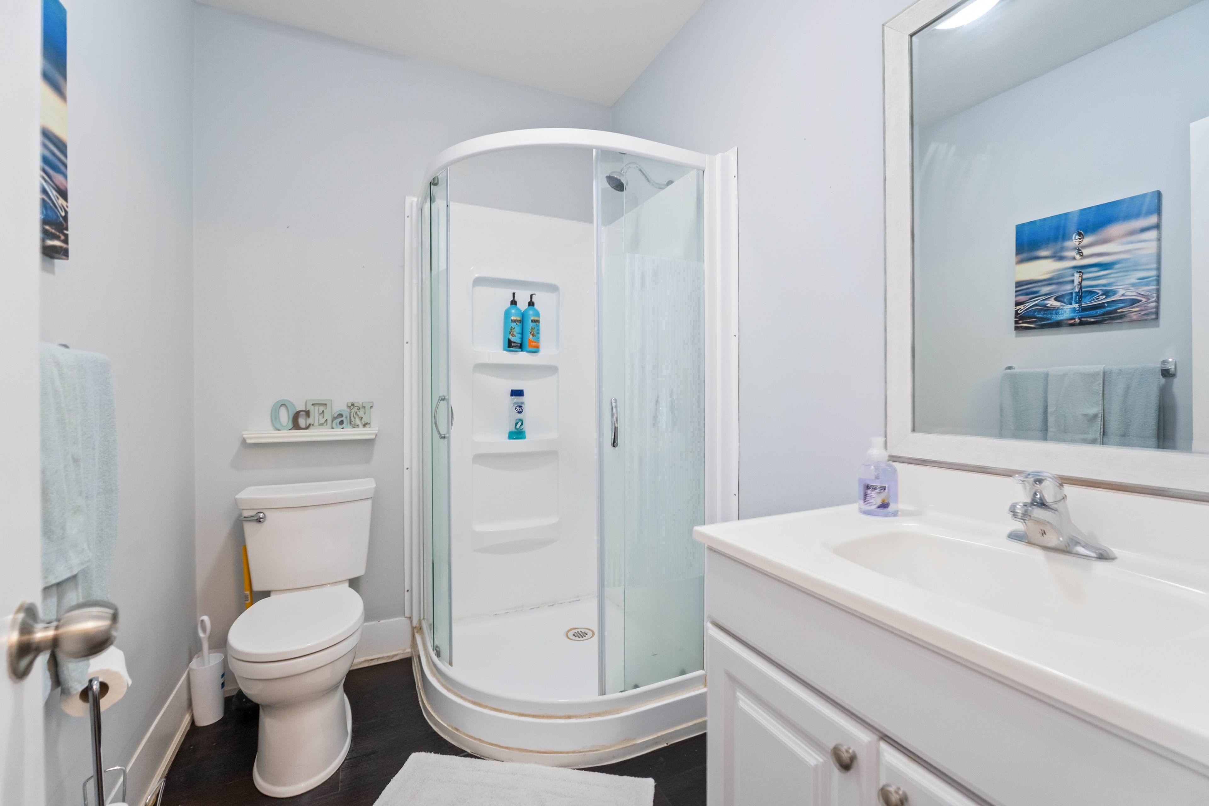 Main floor bathroom with glass shower enclosure
