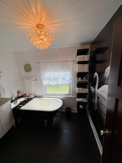 2nd floor bathroom with clawfoot tub and crystal chandelier