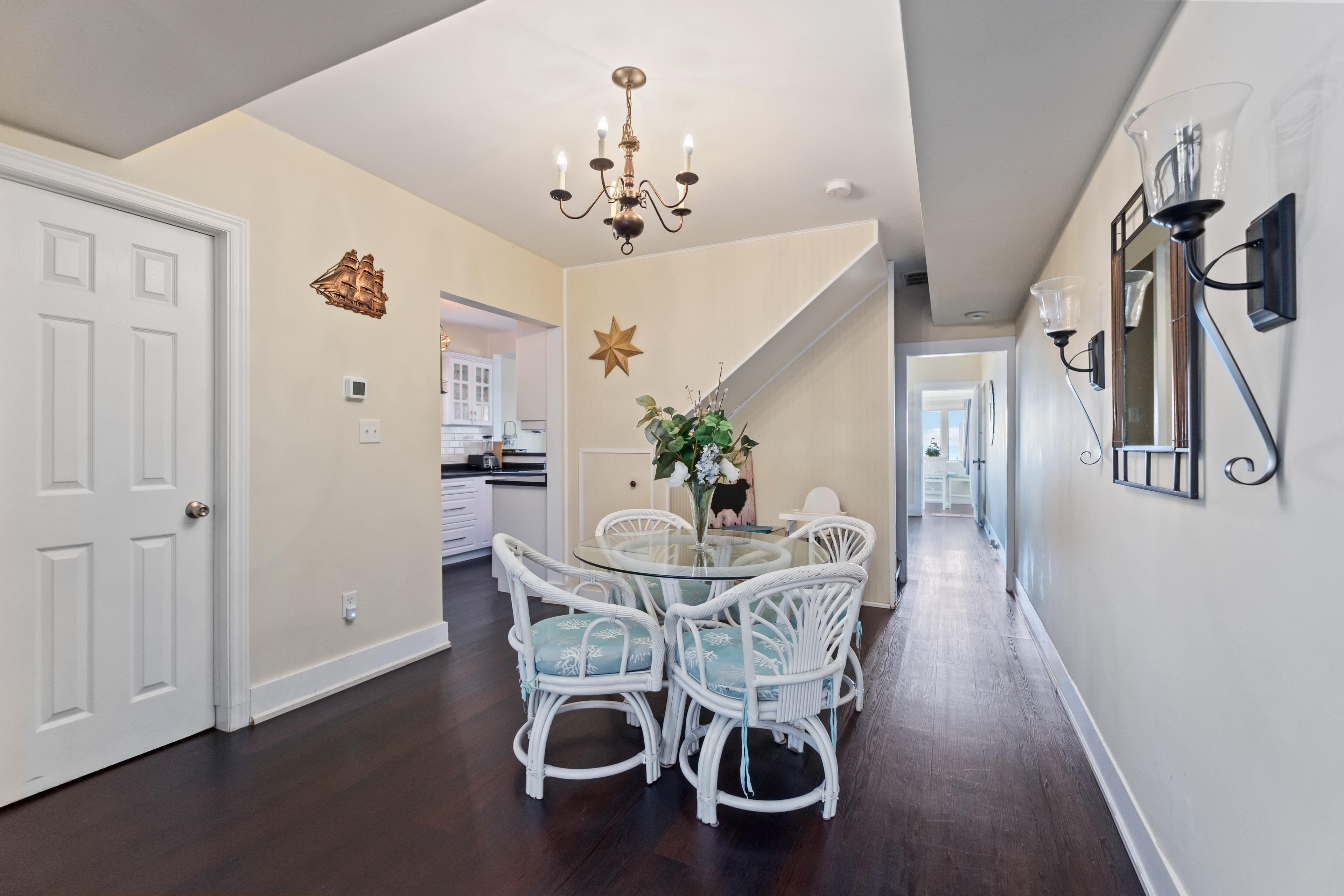 Dining room with coastal wicker chairs