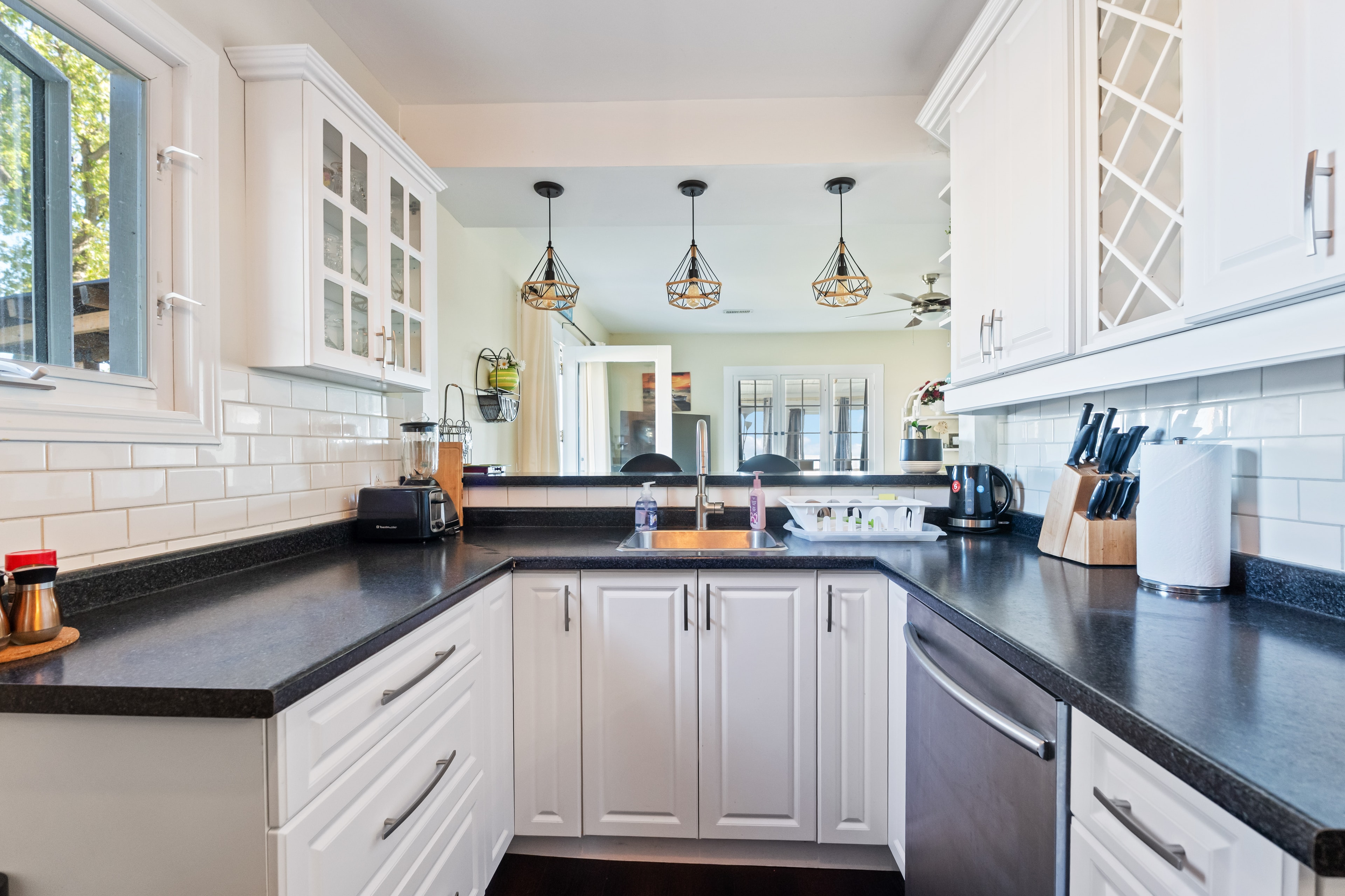Kitchen with pendant lighting and full counter view