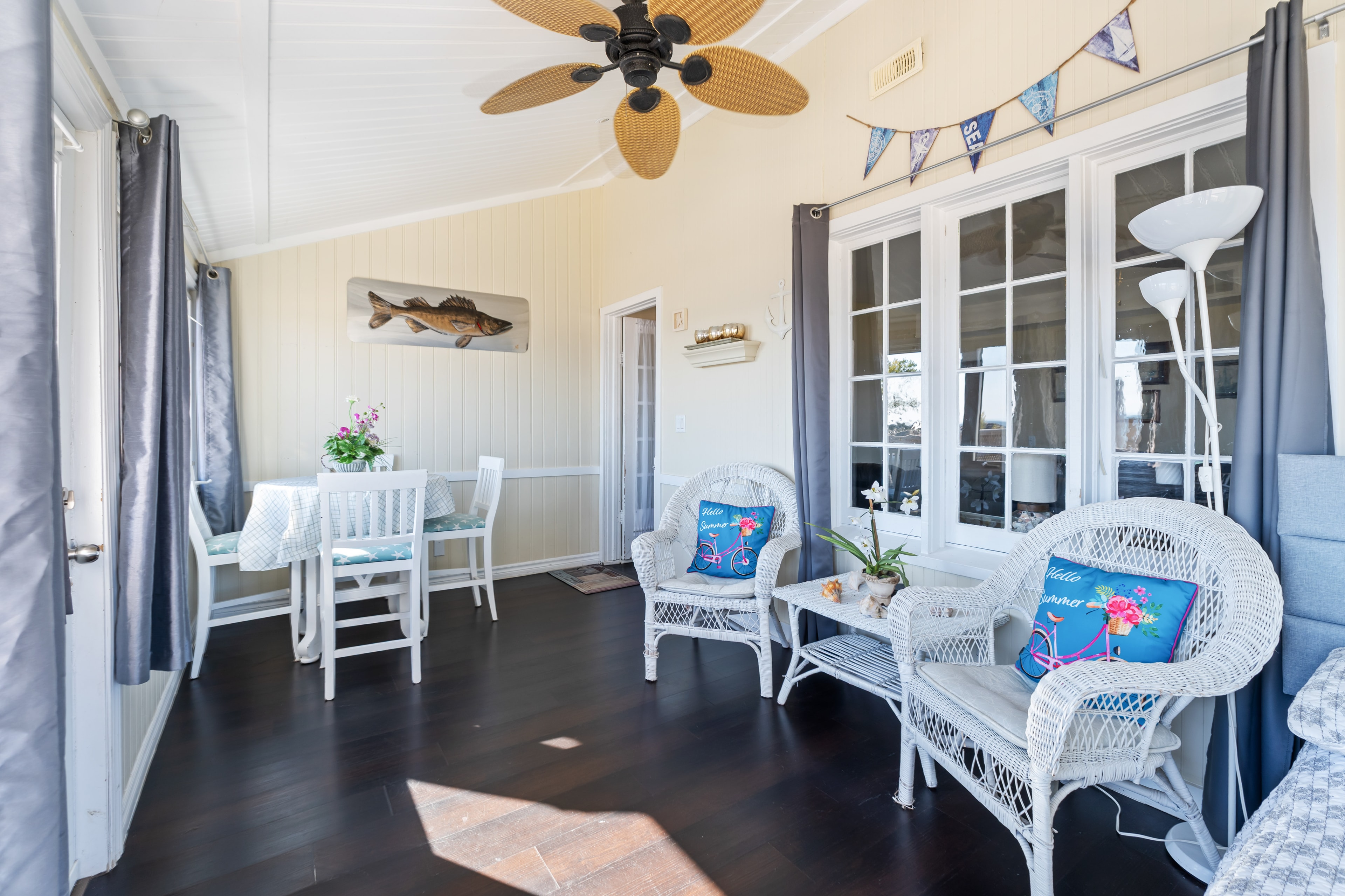 Sunroom sitting area with wicker furniture